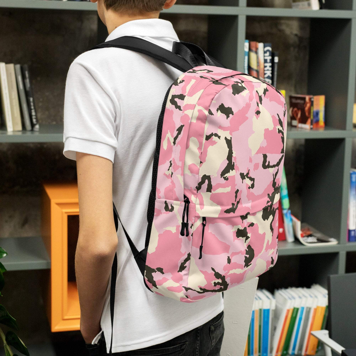 medium size pink camo backpack with multiple pockets worn by person