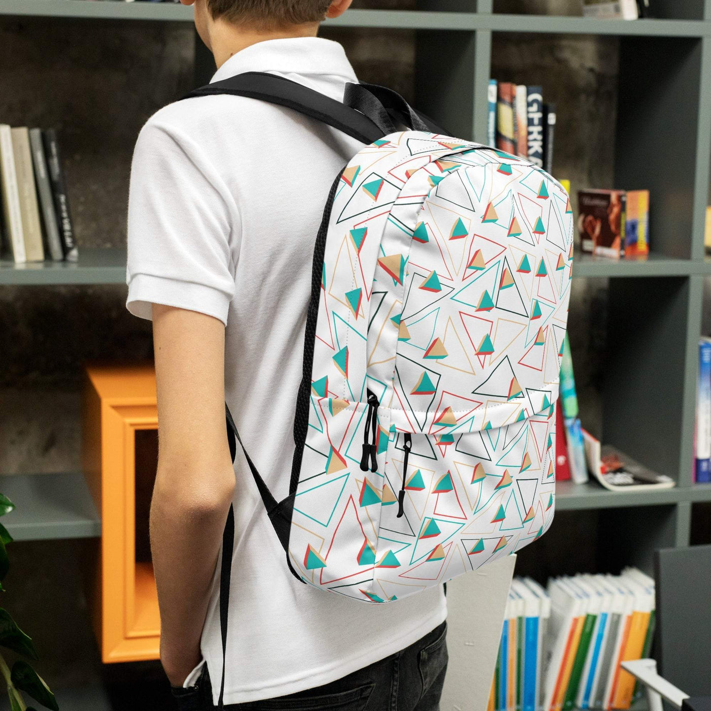 medium size backpack with colorful geometric pattern worn by person indoors