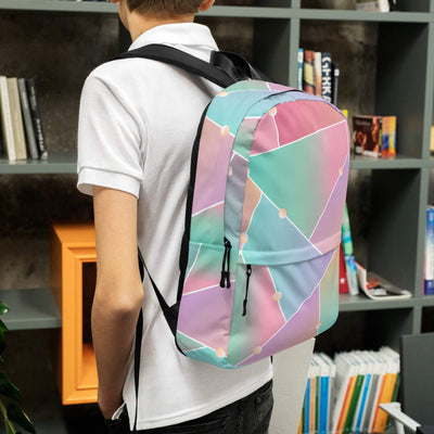 Medium size backpack with pastel geometric pattern worn by person indoors