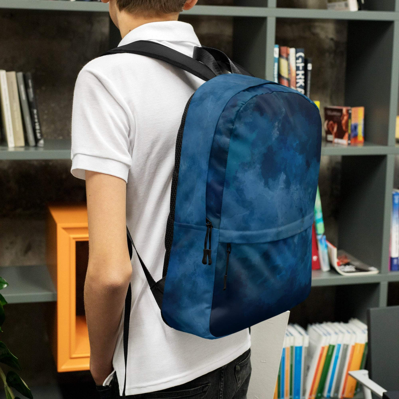medium size blue backpack with multiple zippered pockets worn by person