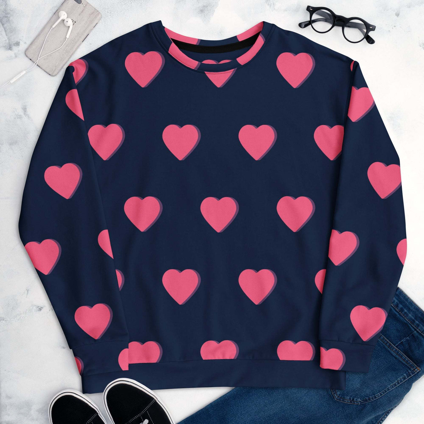 Unisex sweatshirt with navy blue base and pink heart pattern, made from soft cotton-feel recycled fabric with brushed fleece inside.