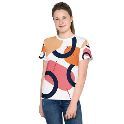 Teen girl wearing colorful abstract printed youth crew neck t-shirt with short sleeves and regular fit