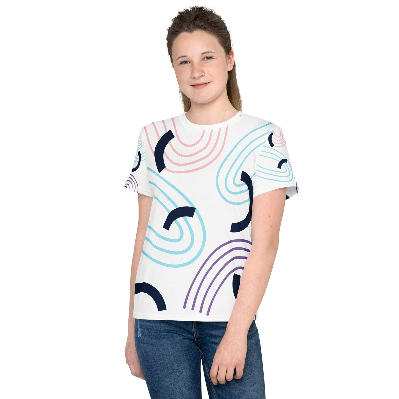 Youth crew neck t-shirt with colorful abstract design, soft stretch fabric, and regular fit modeled by a teen girl