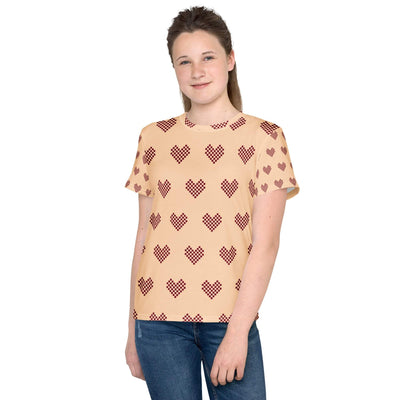 Youth crew neck t-shirt with red heart patterns on beige soft stretch fabric worn by teen girl