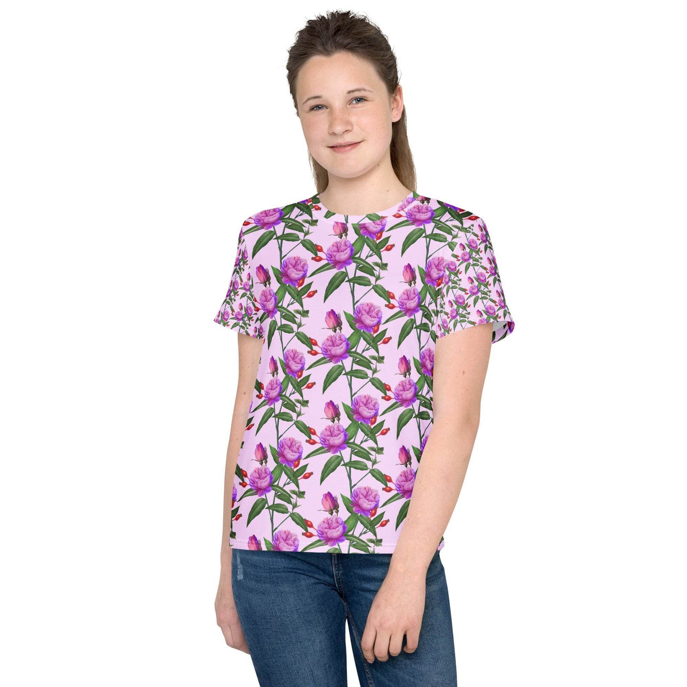 Teen girl wearing a colorful youth crew neck t-shirt with a pink floral design and regular fit