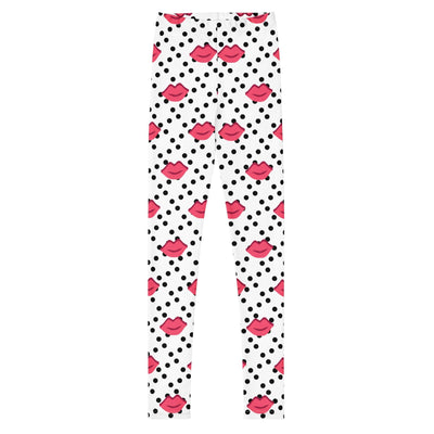 Youth leggings with pink lips and black polka dot pattern on white background, made of stretchy microfiber fabric for comfort and durability.
