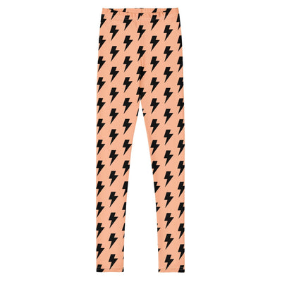 Youth leggings in peach with black lightning bolt pattern, soft elastic fabric, four-way stretch, perfect fit for active kids.