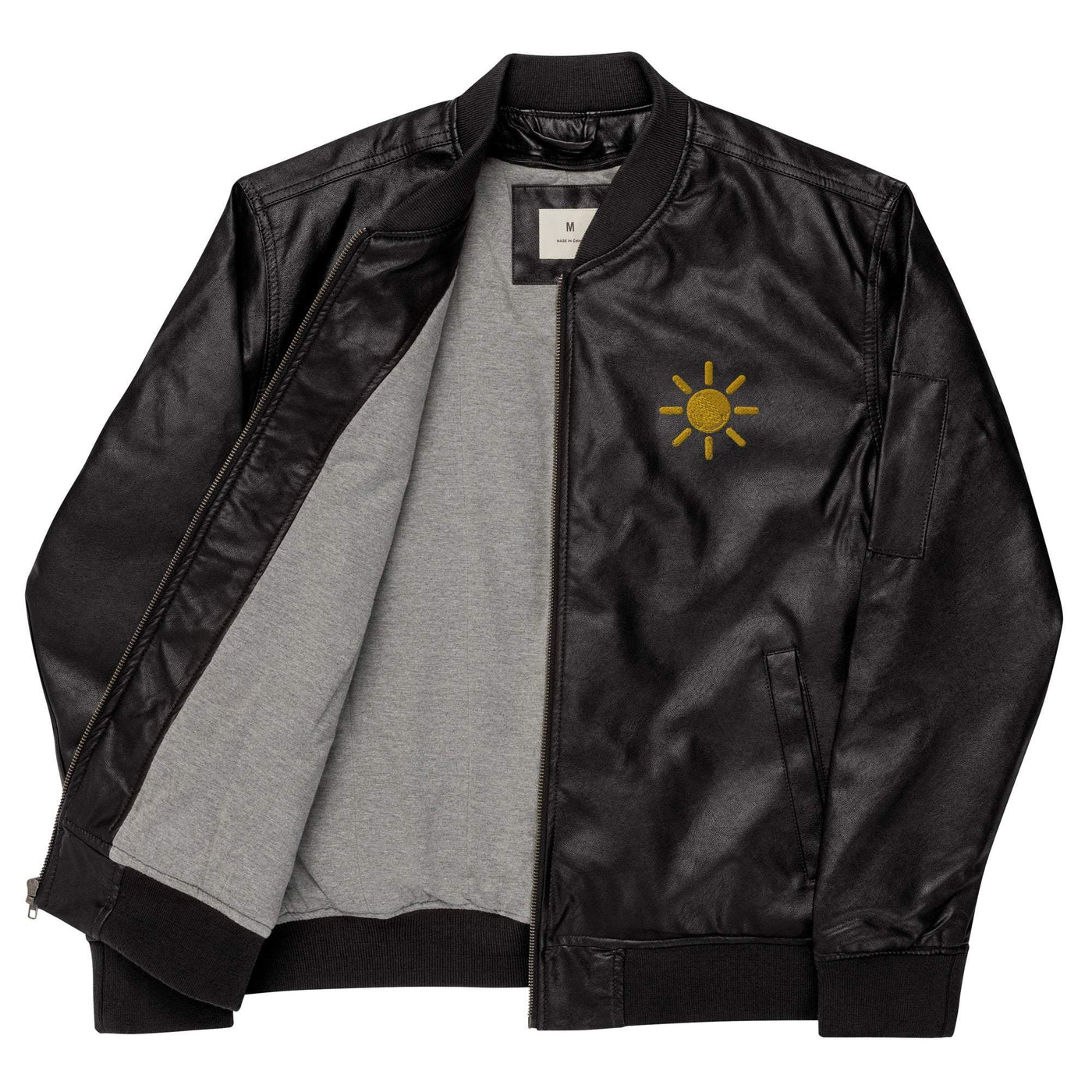 Black leather bomber jacket with rib-knit collar, cuffs, hem, side pockets, utility sleeve pocket, and sun embroidery on chest, gray inner lining.