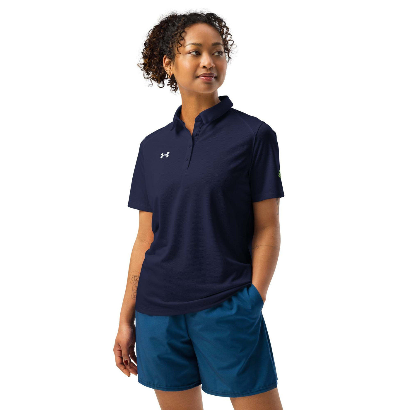 Woman wearing navy Under Armour® women’s polo with breathable fabric and 3-button placket