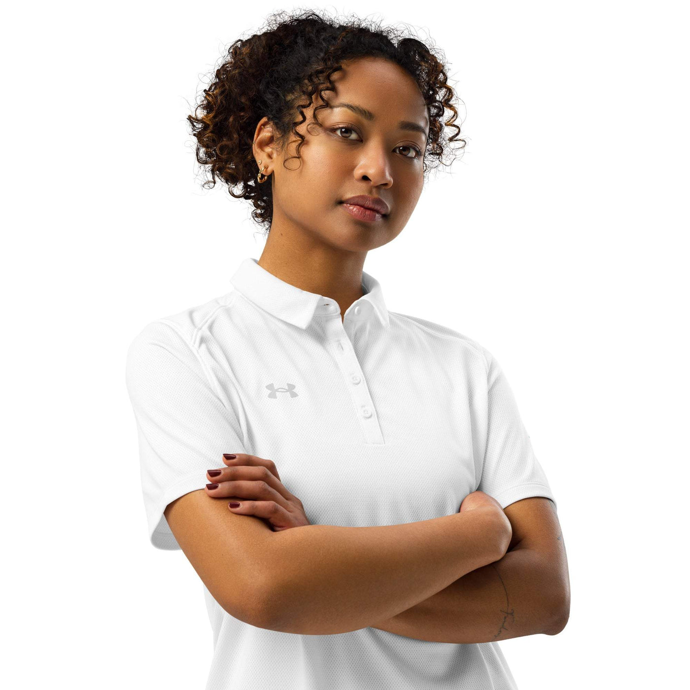 woman wearing white Under Armour women’s polo with 3-button placket and logo on chest