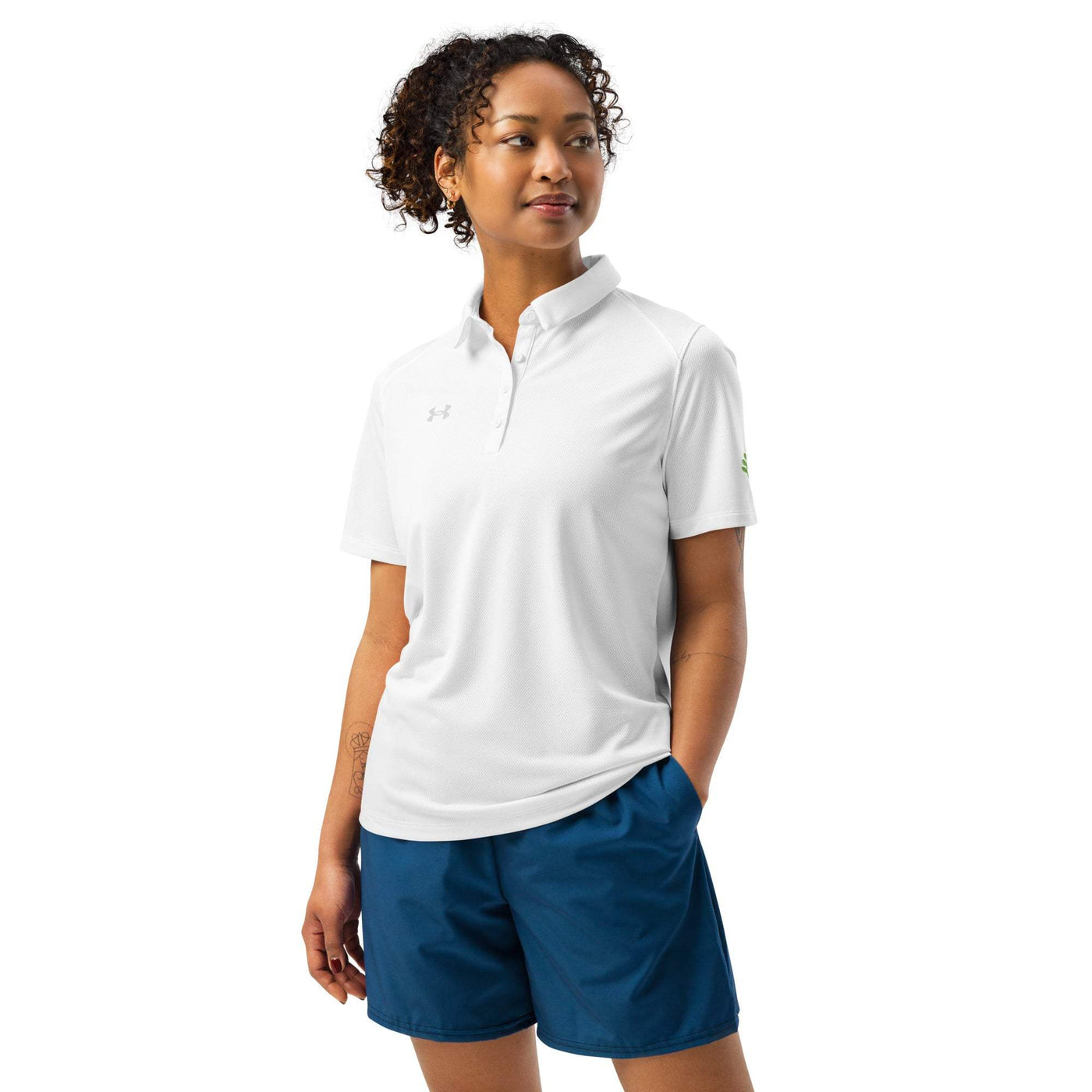 Under Armour women’s white polo shirt with breathable fabric and relaxed fit worn by woman
