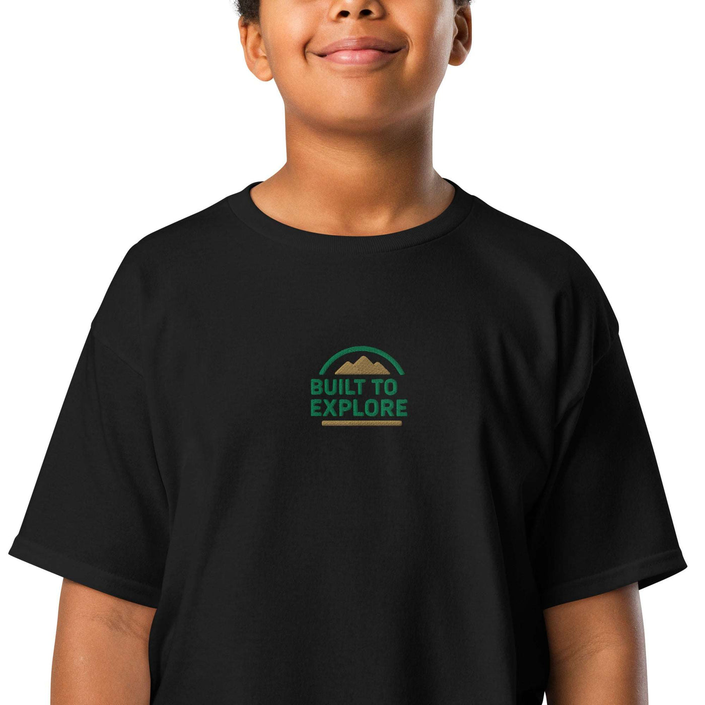 Youth wearing black youth classic tee with "Built to Explore" logo printed on front
