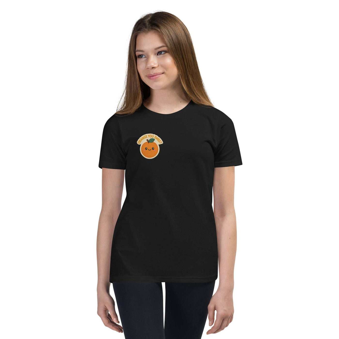 youth short sleeve t-shirt in black with cute orange graphic and relaxed unisex fit worn by girl model